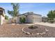 Charming single-story home featuring a well-kept yard with decorative rock and an attached two-car garage at 3955 W Cindy St, Chandler, AZ 85226