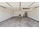 Spacious garage area featuring laundry appliances, storage, and a clean, concrete floor at 3955 W Cindy St, Chandler, AZ 85226