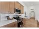 Modern kitchen with stainless steel appliances, stylish wood cabinets, white quartz countertops, and subway tile backsplash at 3955 W Cindy St, Chandler, AZ 85226