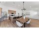 Open kitchen concept with wooden cabinets, stainless steel appliances, kitchen island, and a connected dining area at 3955 W Cindy St, Chandler, AZ 85226