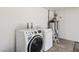 Laundry area featuring modern, front-load washer and dryer and water heater at 3955 W Cindy St, Chandler, AZ 85226
