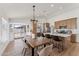Open concept featuring kitchen and dining area with hardwood floors and ample natural light throughout the space at 3955 W Cindy St, Chandler, AZ 85226