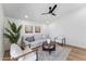 Bright living room with light wood floors, stylish furniture, and modern ceiling fan at 3955 W Cindy St, Chandler, AZ 85226