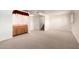 Spacious basement featuring a wet bar and neutral carpet at 4145 W Banff Ln, Phoenix, AZ 85053