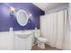 Charming bathroom with elegant fixtures and purple accent wall and wainscoting at 4145 W Banff Ln, Phoenix, AZ 85053