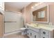 Bathroom featuring a walk-in shower and a classic vanity with decorative hardware at 4145 W Banff Ln, Phoenix, AZ 85053