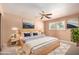Comfortable bedroom with a ceiling fan, a bed, and a stylish rug at 4145 W Banff Ln, Phoenix, AZ 85053