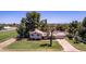Well-maintained single-Gathering home with mature trees and a manicured lawn at 4145 W Banff Ln, Phoenix, AZ 85053