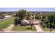 Well-maintained single-Gathering home with mature trees, landscaped lawn, and a private driveway at 4145 W Banff Ln, Phoenix, AZ 85053