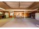 Large garage or workshop with concrete floors and wood paneling throughout at 4145 W Banff Ln, Phoenix, AZ 85053