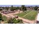 Horse property featuring stables, riding area and large grassy field for grazing at 4145 W Banff Ln, Phoenix, AZ 85053