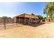View of horse pens featuring metal posts, metal gates and a sand floor at 4145 W Banff Ln, Phoenix, AZ 85053