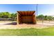 Cozy horse shelter offering protection from the elements with views of green grass at 4145 W Banff Ln, Phoenix, AZ 85053
