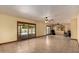 Spacious living room with tile flooring, ceiling fans, and sliding glass doors leading to the outside at 4145 W Banff Ln, Phoenix, AZ 85053