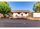 Rear view of a small outbuilding with a brick patio and some outdoor seating at 4145 W Banff Ln, Phoenix, AZ 85053