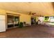 Covered brick patio with ceiling fans offers a comfortable outdoor living space at 4145 W Banff Ln, Phoenix, AZ 85053