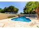 The sparkling private pool with patio and lush landscaping creates a serene backyard oasis at 4145 W Banff Ln, Phoenix, AZ 85053