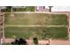 Aerial view showcases large green lawn area and horse facilities at 4145 W Banff Ln, Phoenix, AZ 85053