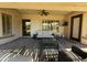 Enjoy outdoor living on this covered patio with comfortable seating and a clear view of the lush yard at 4277 E Blue Sage Ct, Gilbert, AZ 85297