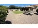 The backyard boasts a patio area, lush greenery, and thoughtful landscaping for serene outdoor enjoyment at 4277 E Blue Sage Ct, Gilbert, AZ 85297