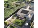 Aerial view of backyard featuring an outdoor kitchen, a patio, and well-kept greenery at 4277 E Blue Sage Ct, Gilbert, AZ 85297