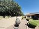 Lush backyard featuring mature trees and manicured landscaping creates a private oasis at 4277 E Blue Sage Ct, Gilbert, AZ 85297