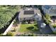 Aerial view of the backyard featuring a pergola, well-maintained lawn, and patio area at 4277 E Blue Sage Ct, Gilbert, AZ 85297