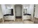 Bathroom featuring double vanities with granite counters and tile flooring with a neutral color palette at 4277 E Blue Sage Ct, Gilbert, AZ 85297