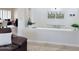 Stylish entryway featuring artwork and a decorative shelf with plants and modern decor at 4277 E Blue Sage Ct, Gilbert, AZ 85297