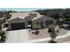 An impressive home featuring a tile roof, manicured landscaping, and private gated entrance at 4277 E Blue Sage Ct, Gilbert, AZ 85297