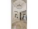 Elegant foyer featuring high ceilings, travertine floors, recessed lighting, and arched entryways at 4277 E Blue Sage Ct, Gilbert, AZ 85297