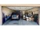 Spacious garage with an open door, car and household items, and great storage at 4277 E Blue Sage Ct, Gilbert, AZ 85297