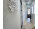 Bright hallway with stylish decor, white walls, and tile flooring offering a clean, modern look at 4277 E Blue Sage Ct, Gilbert, AZ 85297