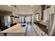 Modern kitchen featuring an island with a sink, stylish pendant lights, and stainless steel appliances at 4277 E Blue Sage Ct, Gilbert, AZ 85297