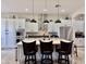 Spacious kitchen showcases a large island with seating, stainless steel appliances, and elegant pendant lighting at 4277 E Blue Sage Ct, Gilbert, AZ 85297
