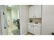 Bright laundry area featuring tile floors, cabinets for storage, and modern washer and dryer hookups at 4277 E Blue Sage Ct, Gilbert, AZ 85297