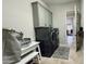 Chic laundry room with gray storage cabinets and front load washer and dryer at 4277 E Blue Sage Ct, Gilbert, AZ 85297