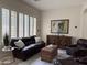 Spacious living room with comfortable seating, plantation shutters, and decorative accents at 4277 E Blue Sage Ct, Gilbert, AZ 85297