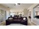 View from living room to kitchen featuring an open floor plan with bright lighting and arched entryways at 4277 E Blue Sage Ct, Gilbert, AZ 85297