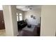 Cozy living area showcasing dark wood floors, a ceiling fan, and plantation shutters at 4277 E Blue Sage Ct, Gilbert, AZ 85297