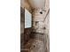 Bathroom shower with dark tile, glass block window, and a built-in bench at 4277 E Blue Sage Ct, Gilbert, AZ 85297