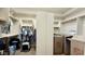 Spacious walk-in closet featuring multiple shelves and rods for organized storage solutions at 4277 E Blue Sage Ct, Gilbert, AZ 85297