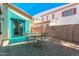 Inviting outdoor space with blue shade cover, paver patio, string lights and a patio set at 4682 E Redfield Rd, Gilbert, AZ 85234