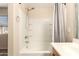 Clean white bathroom featuring a shower-tub combo and chrome fixtures at 4682 E Redfield Rd, Gilbert, AZ 85234