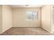 Neutral bedroom featuring carpeted floor, window with blinds, and accessible outlets on the wall at 4682 E Redfield Rd, Gilbert, AZ 85234