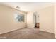 Bright bedroom featuring a large window and ensuite bathroom access at 4682 E Redfield Rd, Gilbert, AZ 85234