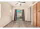 Bedroom with carpet, neutral walls, ceiling fan, and sliding doors to the backyard at 4682 E Redfield Rd, Gilbert, AZ 85234