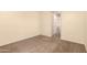 Vacant bedroom with tan walls and neutral carpet at 4682 E Redfield Rd, Gilbert, AZ 85234