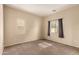 Comfortable bedroom with neutral walls and carpet flooring, creating a serene retreat at 4682 E Redfield Rd, Gilbert, AZ 85234