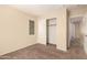 Neutral bedroom with carpeted floors, a window, and a closet with sliding doors at 4682 E Redfield Rd, Gilbert, AZ 85234